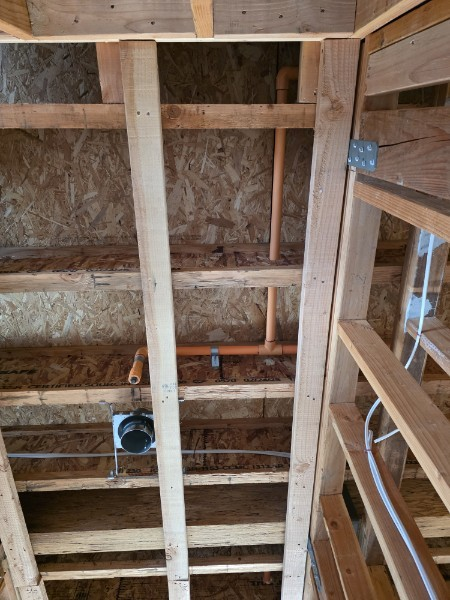 Fire sprinkler piping rough-in between ceiling joists